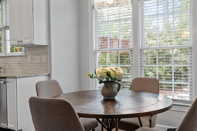 dining space with a notable chandelier