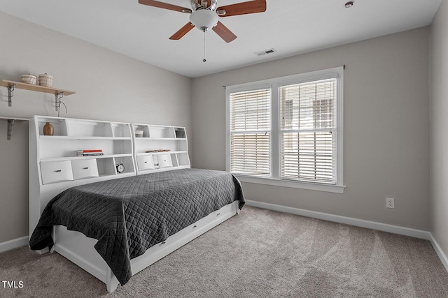 bedroom featuring ceiling fan, carpet floors, visible vents, and baseboards