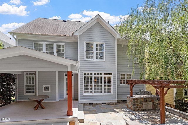 rear view of house featuring crawl space, a shingled roof, a pergola, and a patio