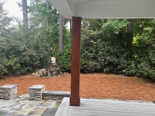 view of yard with a wooden deck