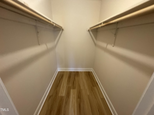 spacious closet with wood finished floors