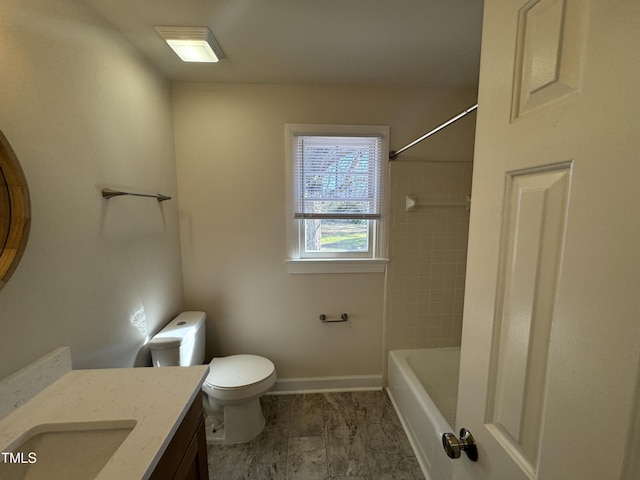 bathroom with toilet, shower / tub combination, baseboards, and vanity