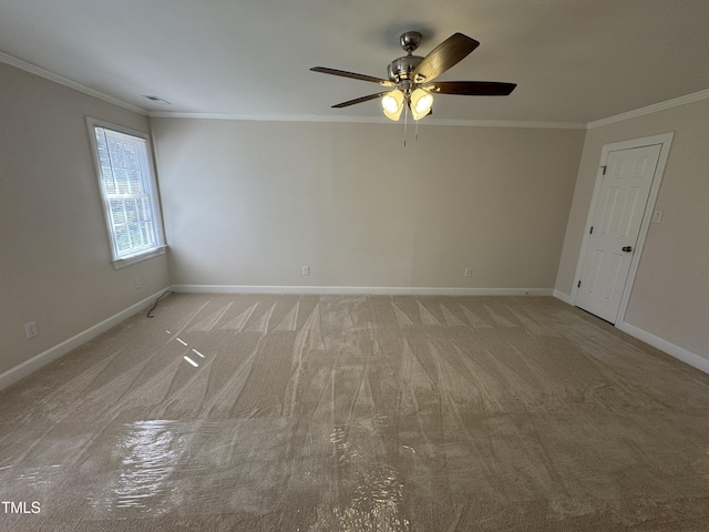 unfurnished room with visible vents, ornamental molding, a ceiling fan, light carpet, and baseboards