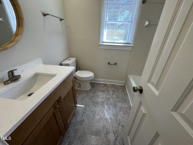 full bath with toilet, baseboards, and vanity