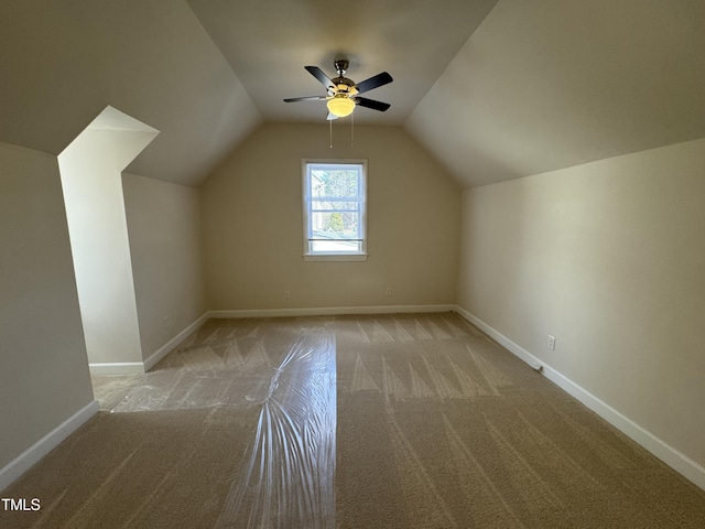 bonus room featuring lofted ceiling, ceiling fan, baseboards, and carpet flooring