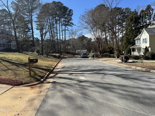 view of road with curbs