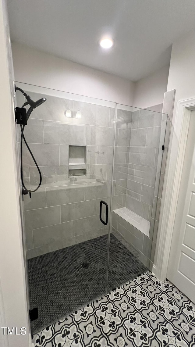 bathroom with a shower stall