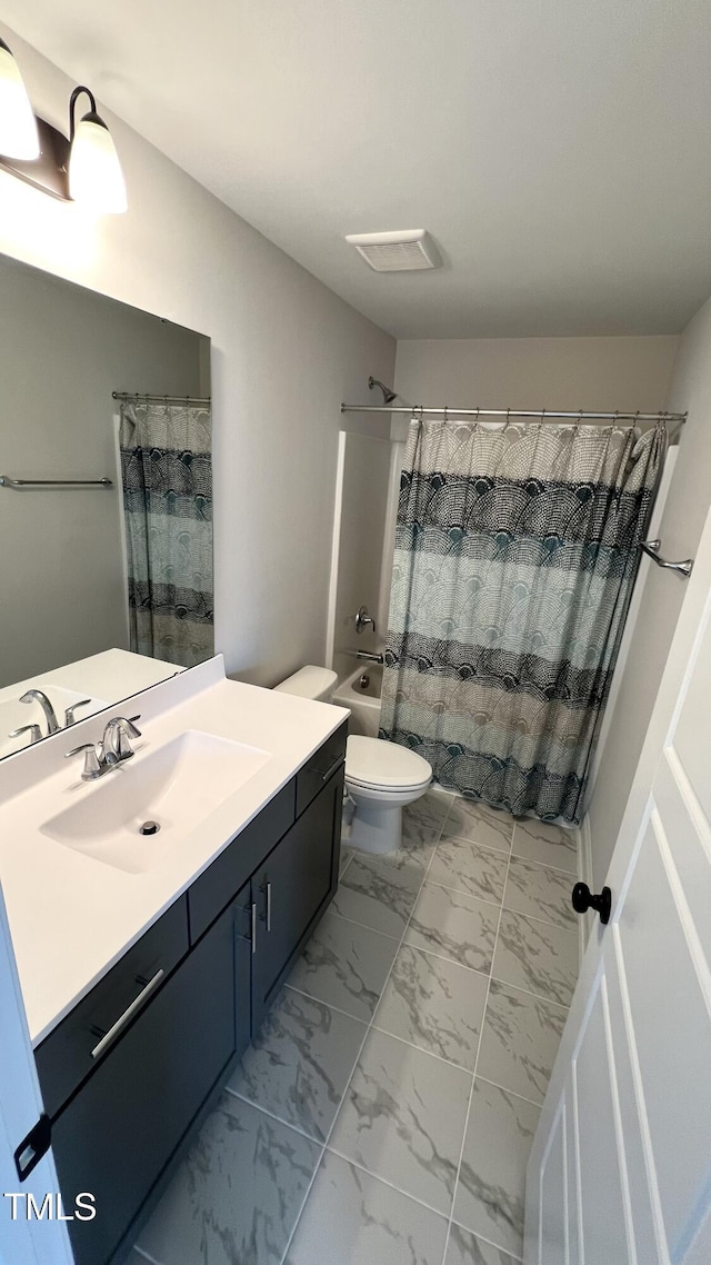 full bath featuring marble finish floor, visible vents, toilet, shower / bath combo, and vanity