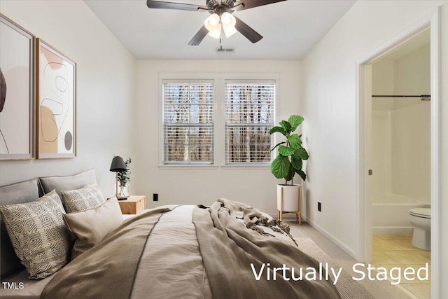 bedroom featuring light tile patterned floors, baseboards, and visible vents