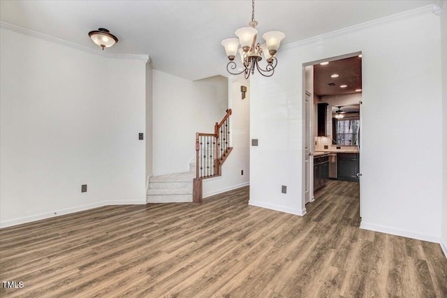 unfurnished dining area featuring baseboards, crown molding, stairway, and dark wood-type flooring