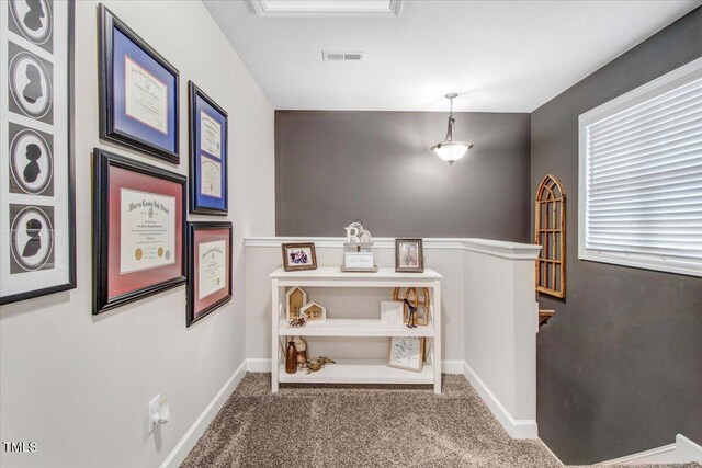 301 Stonebridge Dr, Pikeville, NC 27863 - corridor with carpet, an upstairs landing, visible vents, and baseboards