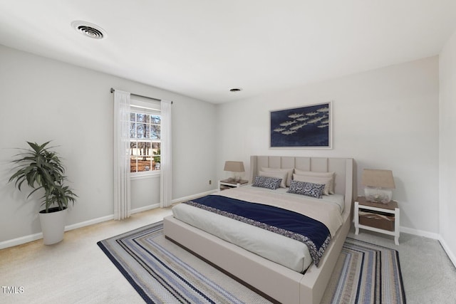 carpeted bedroom with baseboards and visible vents