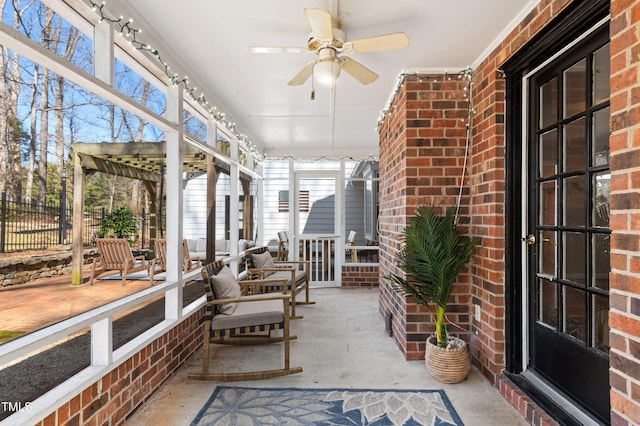 sunroom / solarium with ceiling fan