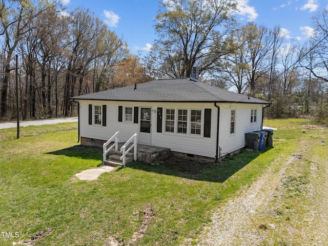 view of front of house with a chimney, a front lawn, crawl space, and roof with shingles