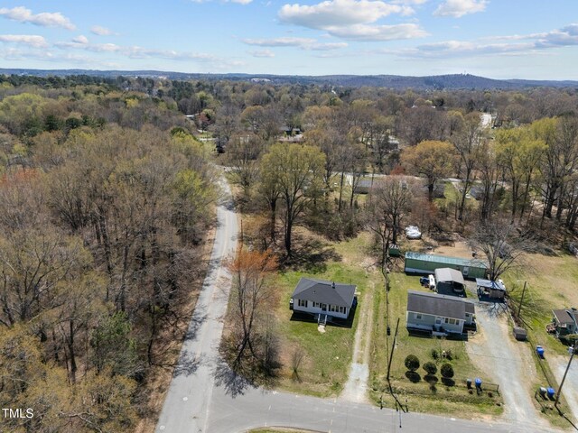 birds eye view of property with a forest view