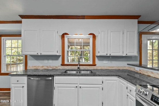 kitchen featuring crown molding, appliances with stainless steel finishes, white cabinets, and a sink