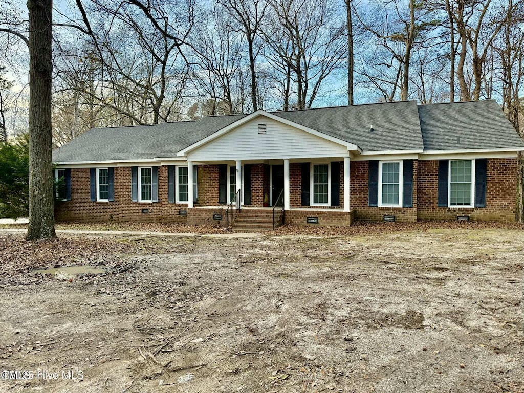 2900 Tripp Ln, Greenville, NC 27834 - single story home featuring roof with shingles, brick siding, and crawl space