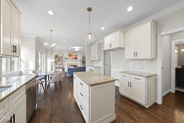 kitchen featuring dishwasher, open floor plan, a fireplace, and dark wood finished floors