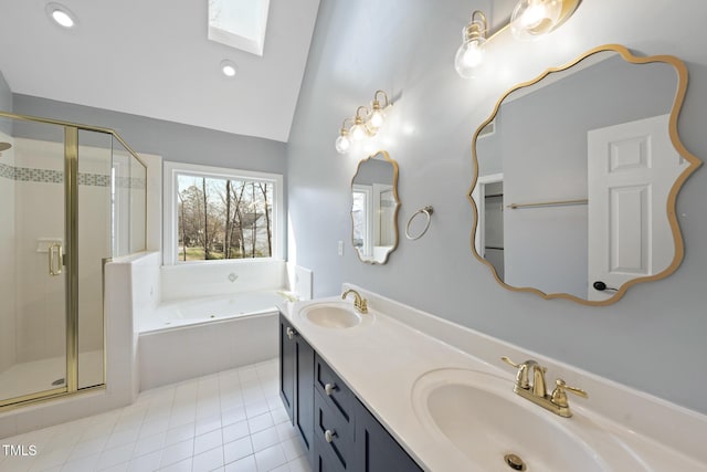 bathroom featuring a garden tub, lofted ceiling with skylight, a sink, and a stall shower