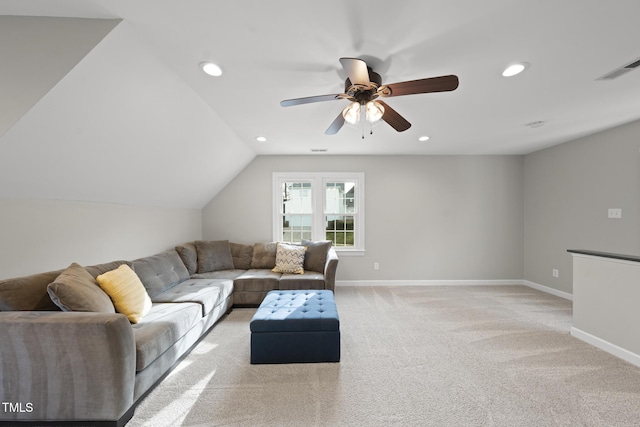 living room with recessed lighting, light colored carpet, and baseboards