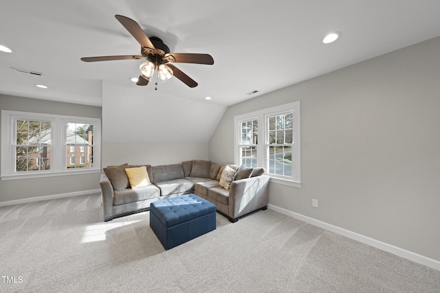 living room featuring lofted ceiling, recessed lighting, visible vents, light carpet, and baseboards