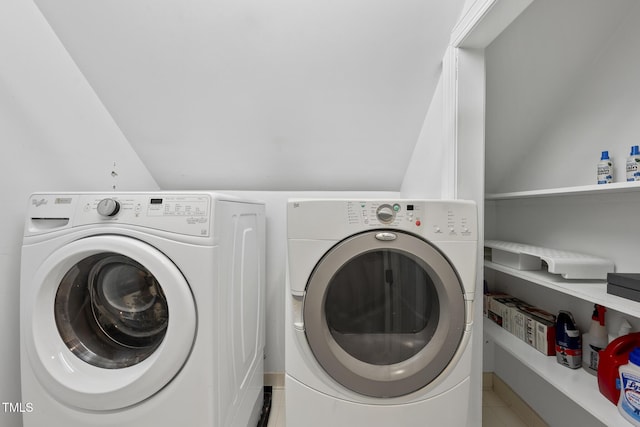 clothes washing area with washing machine and dryer and laundry area