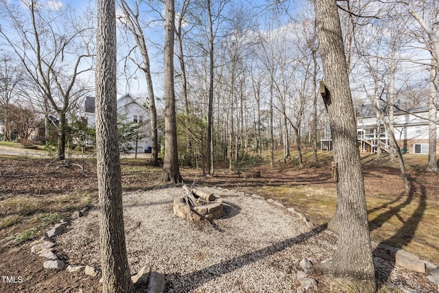 view of yard featuring a fire pit