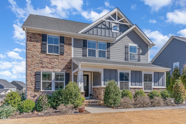 craftsman inspired home with board and batten siding and stone siding