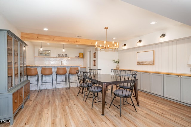 dining area featuring visible vents, recessed lighting, light wood-style flooring, and a notable chandelier