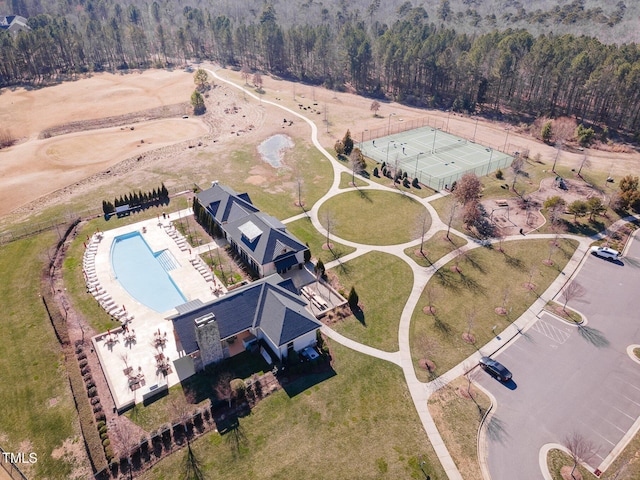 drone / aerial view featuring a view of trees