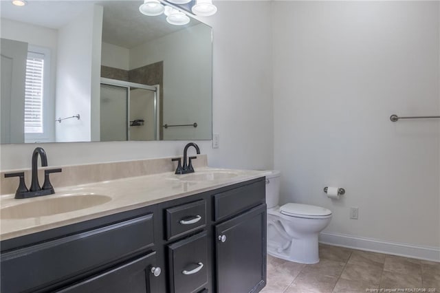 full bath with double vanity, tile patterned flooring, a sink, and a shower stall