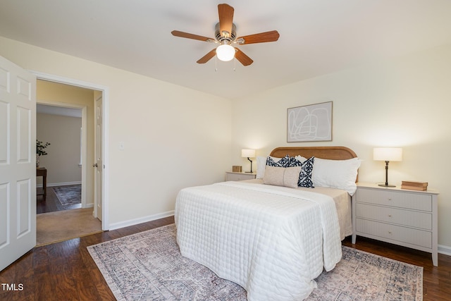 bedroom with a ceiling fan, baseboards, and wood finished floors