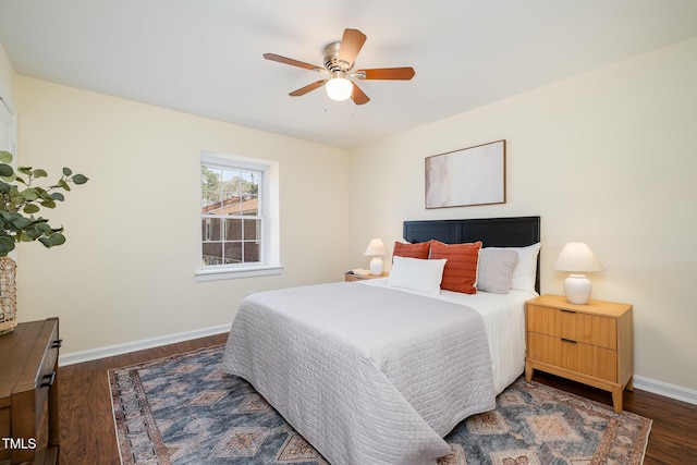 bedroom with wood finished floors, a ceiling fan, and baseboards