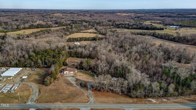 drone / aerial view featuring a view of trees