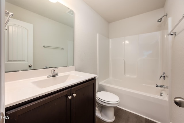 full bath with visible vents, toilet, wood finished floors, bathtub / shower combination, and vanity