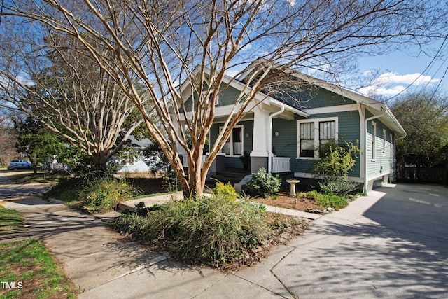 view of front of house with a porch and concrete driveway