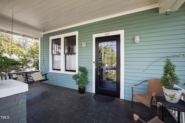 property entrance with a porch