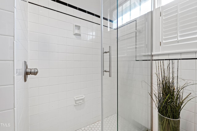 bathroom featuring a shower stall