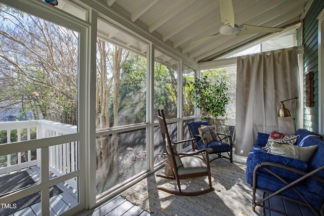 sunroom / solarium with vaulted ceiling with beams and ceiling fan