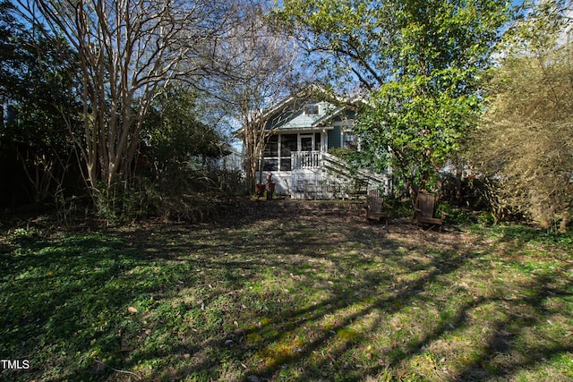 view of yard with a sunroom