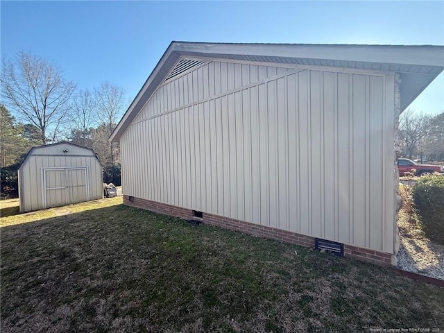 view of property exterior with a storage shed, crawl space, an outdoor structure, and a lawn