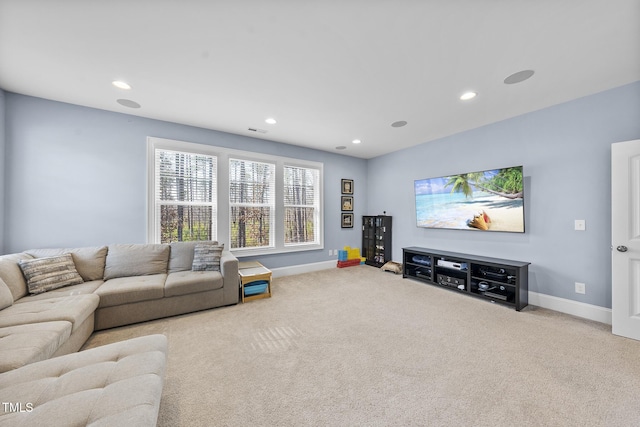 carpeted living area featuring visible vents, baseboards, and recessed lighting