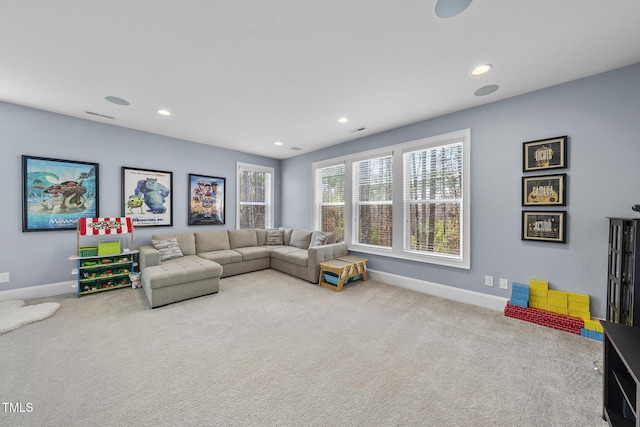 carpeted living room featuring visible vents, baseboards, and recessed lighting