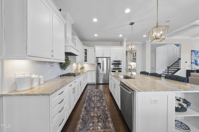 kitchen with stainless steel appliances, tasteful backsplash, and white cabinetry