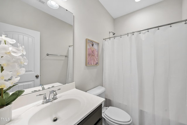 bathroom with toilet and vanity