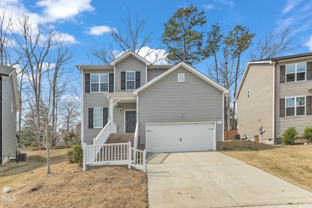 traditional home featuring driveway, a garage, cooling unit, and a front yard