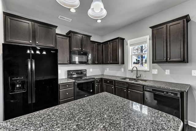 kitchen featuring black appliances, dark brown cabinets, a sink, and visible vents