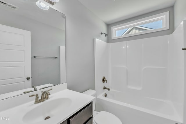 bathroom with visible vents, vanity, toilet, and shower / bathtub combination