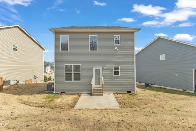 rear view of house with entry steps, crawl space, cooling unit, and a patio area