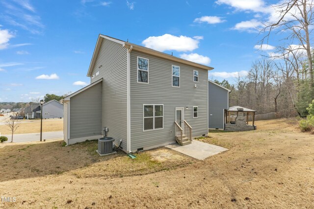 back of house with entry steps, crawl space, and central AC unit